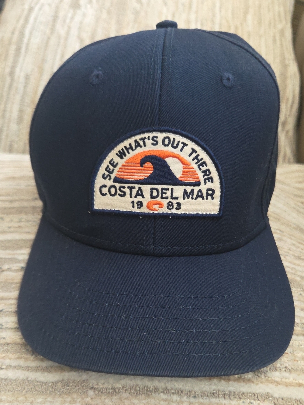 New Costa Men’s Navy Patch Wave Cap with Orange Accents